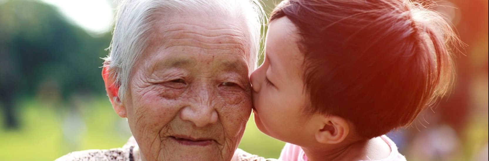 Grandchild kissing Grandma